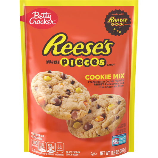 Front of Betty Crocker Reese's Peanut Butter Cookie Mix (337g) bag featuring a bright red background, Reese's pieces logo, and images of freshly baked cookies.