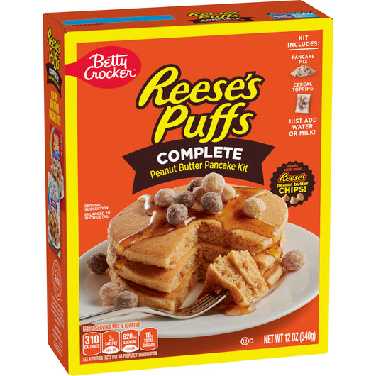 Front of Betty Crocker Reese's Peanut Butter Pancake Mix box, showcasing the logo, pancake kit details, and stack of pancakes with peanut butter cereal topping (340g pack)