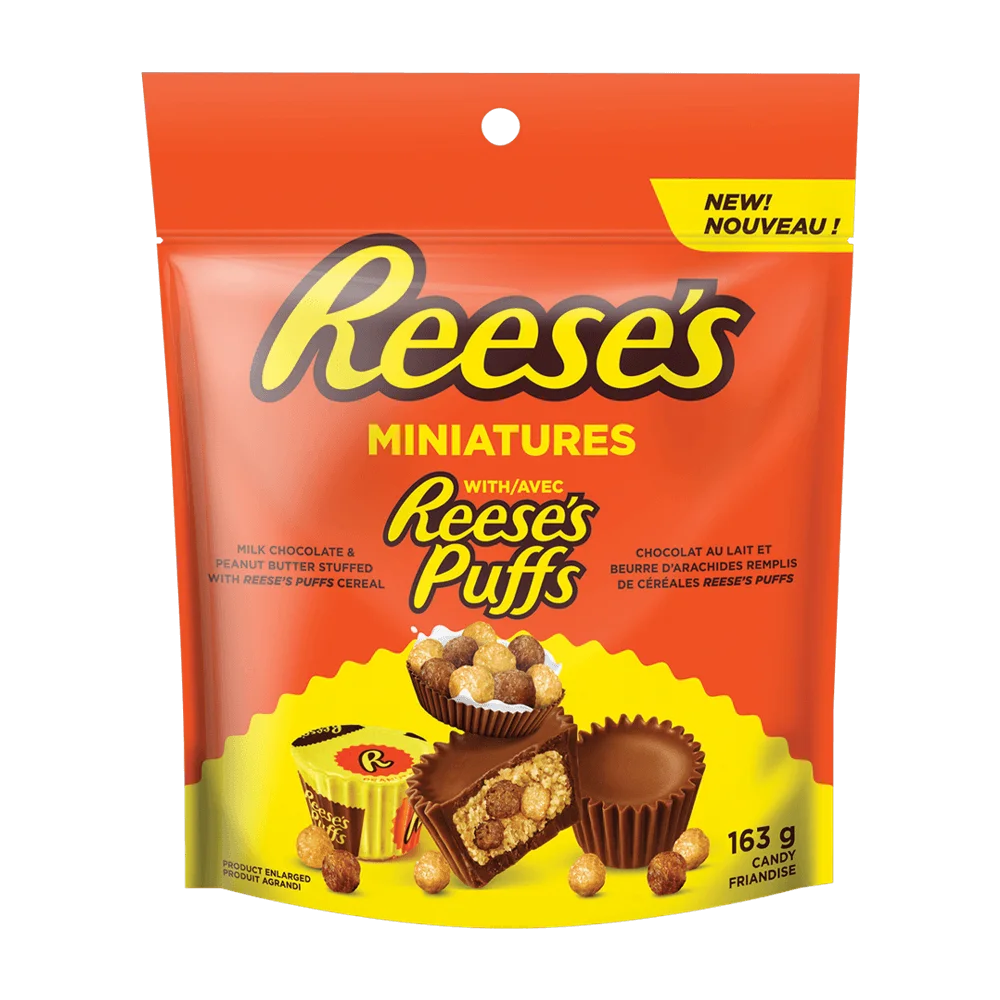 Front of Reese's Miniatures with Reese's Puffs bag displaying vibrant orange and yellow design, featuring milk chocolate cups and cereal pieces (163g pack)