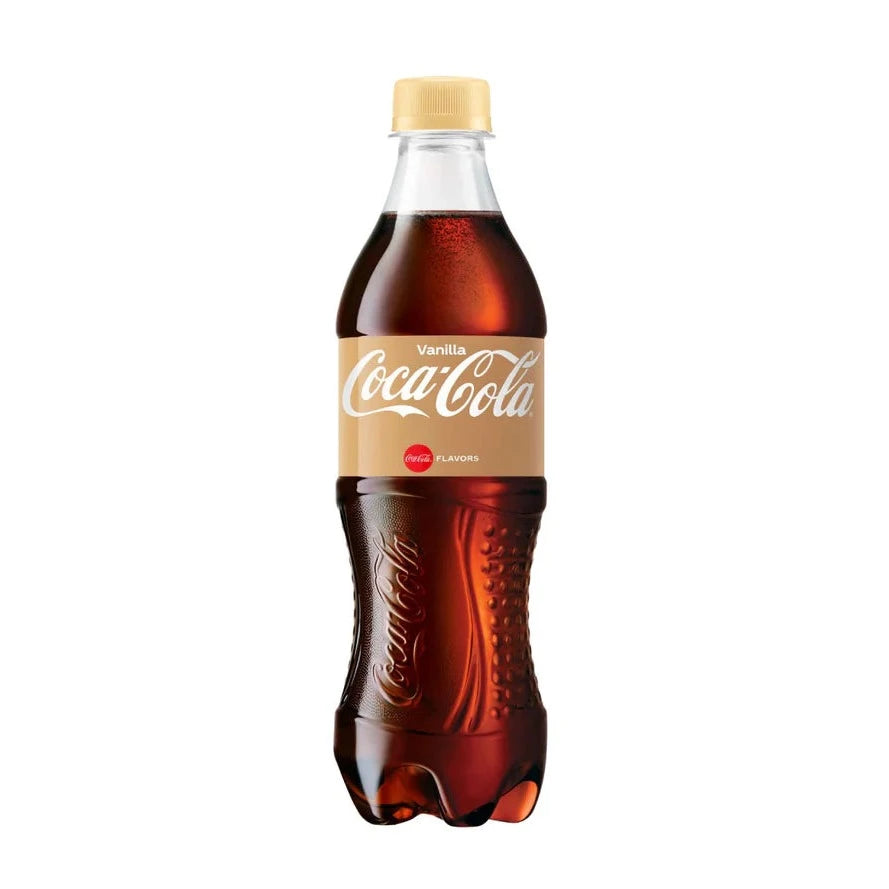 Front of Coca Cola Vanilla 500ml bottle showing the logo, creamy vanilla flavour label, and deep amber drink.