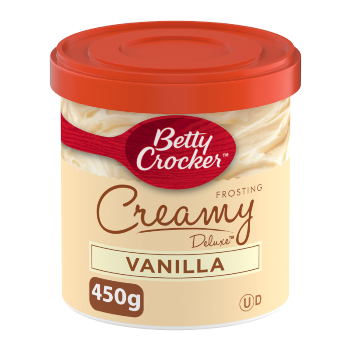 Front of Betty Crocker Creamy Deluxe Vanilla Frosting tub showing brand logo, creamy vanilla flavour, and 450g pack size.