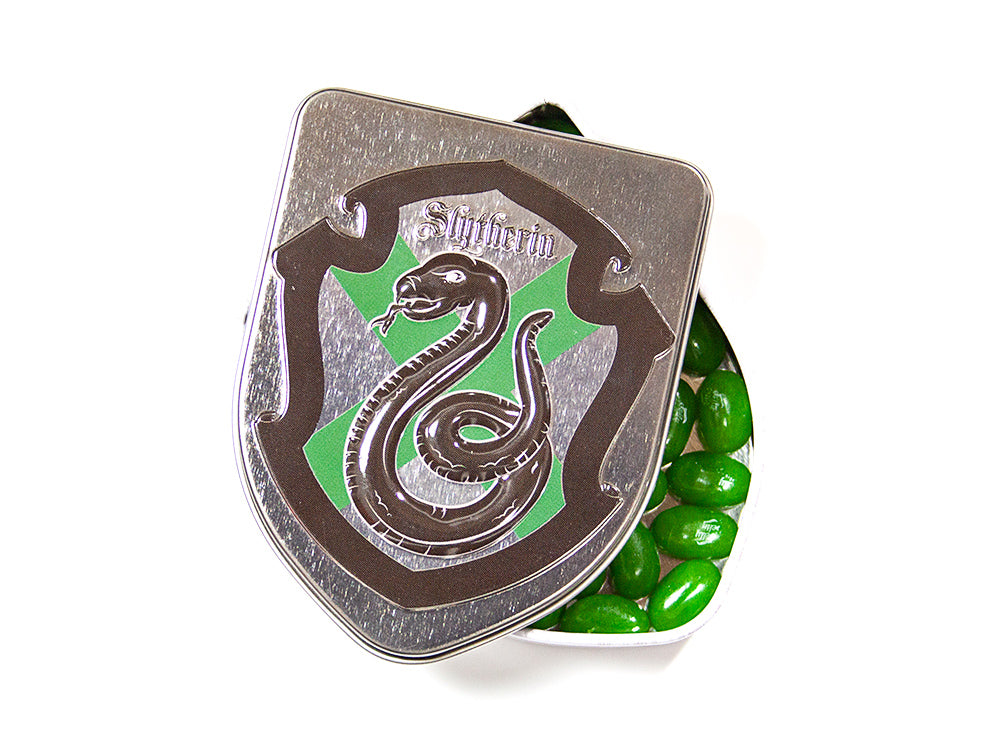 Front of Harry Potter SLYTHERIN Crest Tin with Jelly Beans showing the green Slytherin crest and a view of jelly beans inside (28g tin)