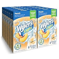 Front of Wyler's Peach Singles To Go packaging showing peach flavour, brand logo, and pack of 12 single-serve drink mix packets (213.6g)
