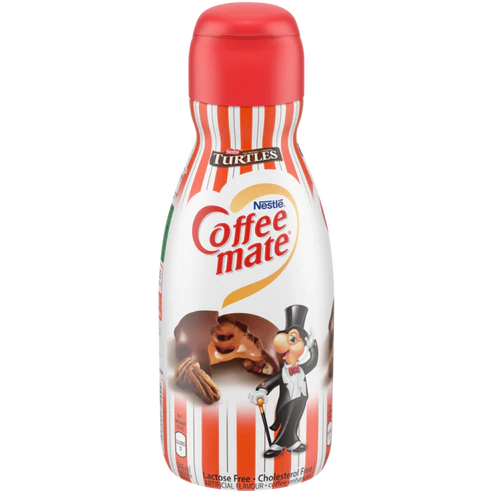 Front of Coffee-Mate Turtles Chocolate, Caramel & Pecan Creamer bottle showing logo and rich chocolate, caramel, and pecan imagery (946ml)