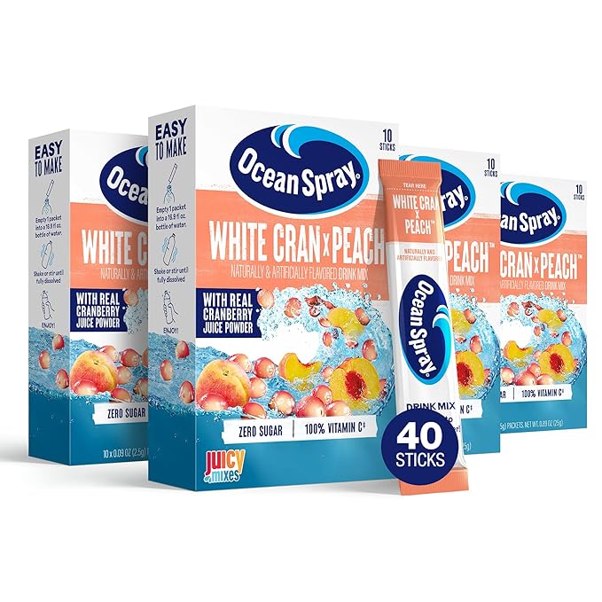 Front of Ocean Spray White Cran x Peach Singles to Go packaging showing brand logo, peach and cranberry flavours, and 12 pack of drink mixes