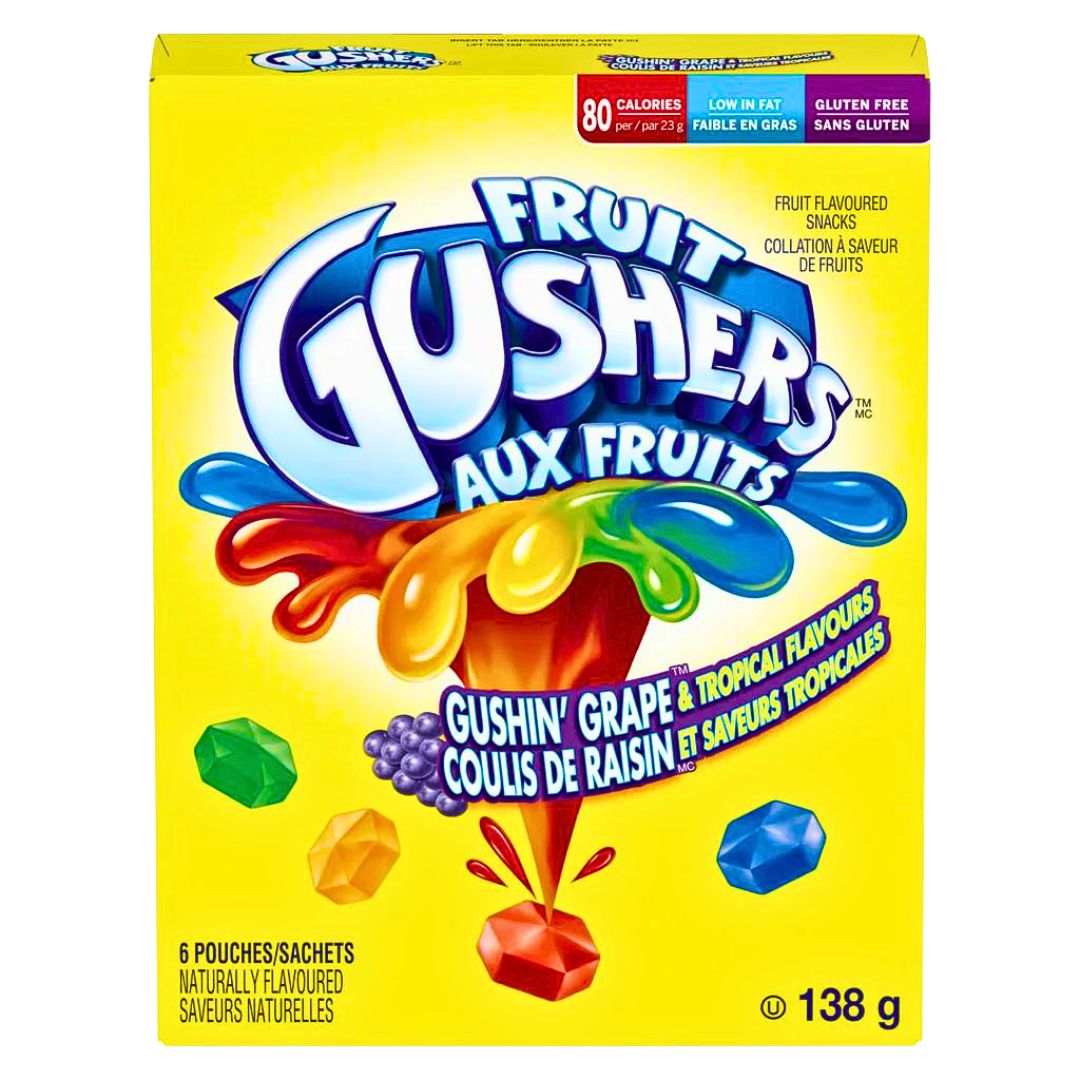 Front of Fruit Gushers Tropical box showing bold logo, tropical flavour label, and colourful fruit-shaped snacks (138g pack)