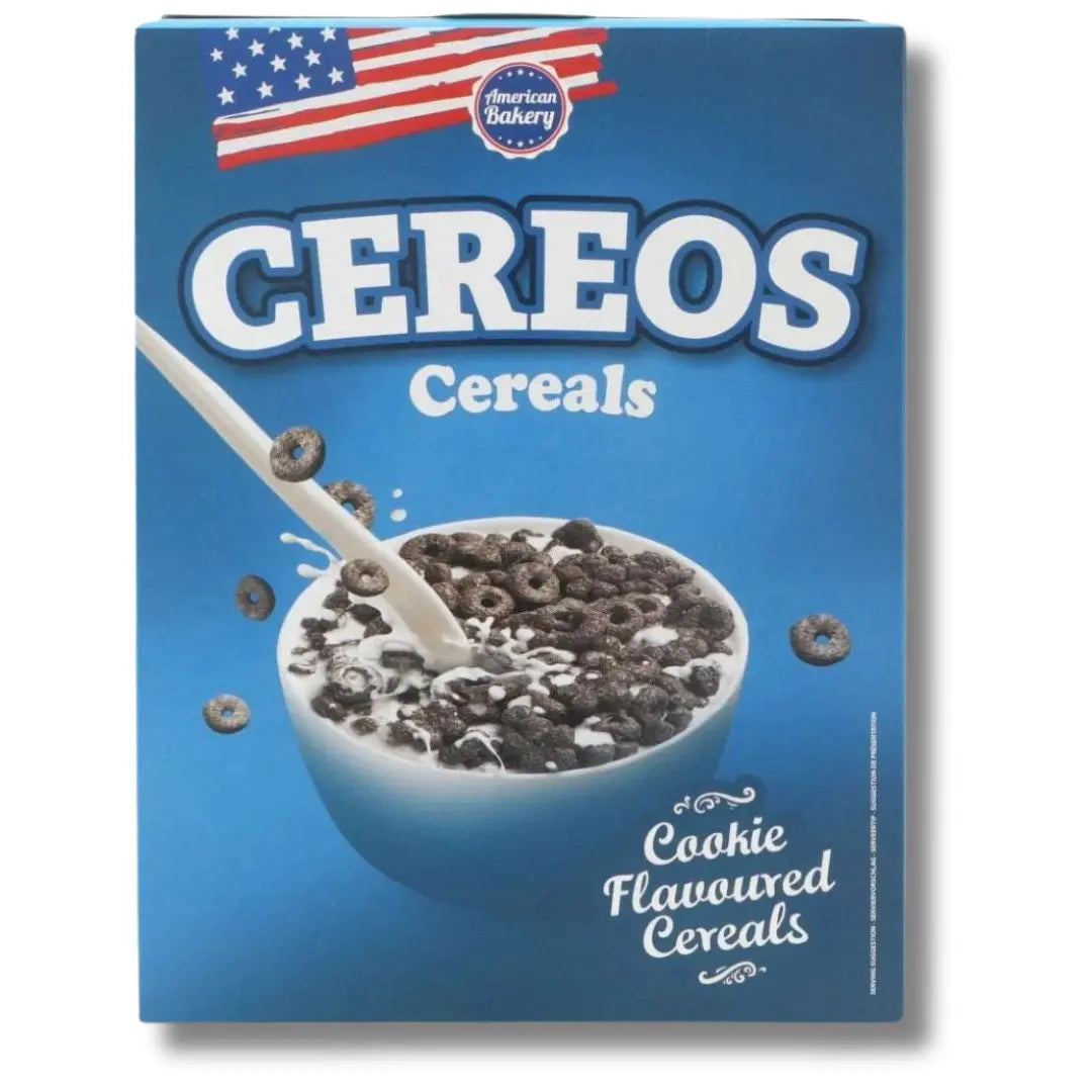 Front of American Bakery Cereos Cereal box showing cookie flavoured cereals, blue background, and image of a bowl with milk and cereals (180g pack)