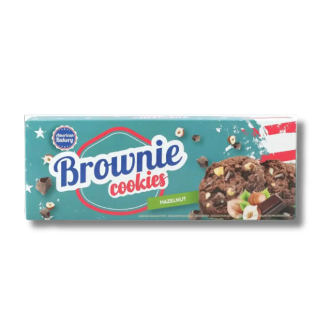 Front of American Bakery Brownie Cookies With Hazelnut pack showing clear logo, brownie cookie images, and hazelnut visual (106g pack)