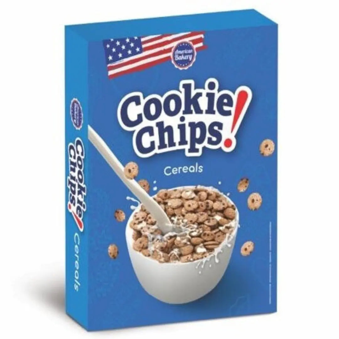Front of American Bakery Cookie Chips Cereal box featuring a blue background, logo, and a bowl of cookie flakes with milk (180g pack)
