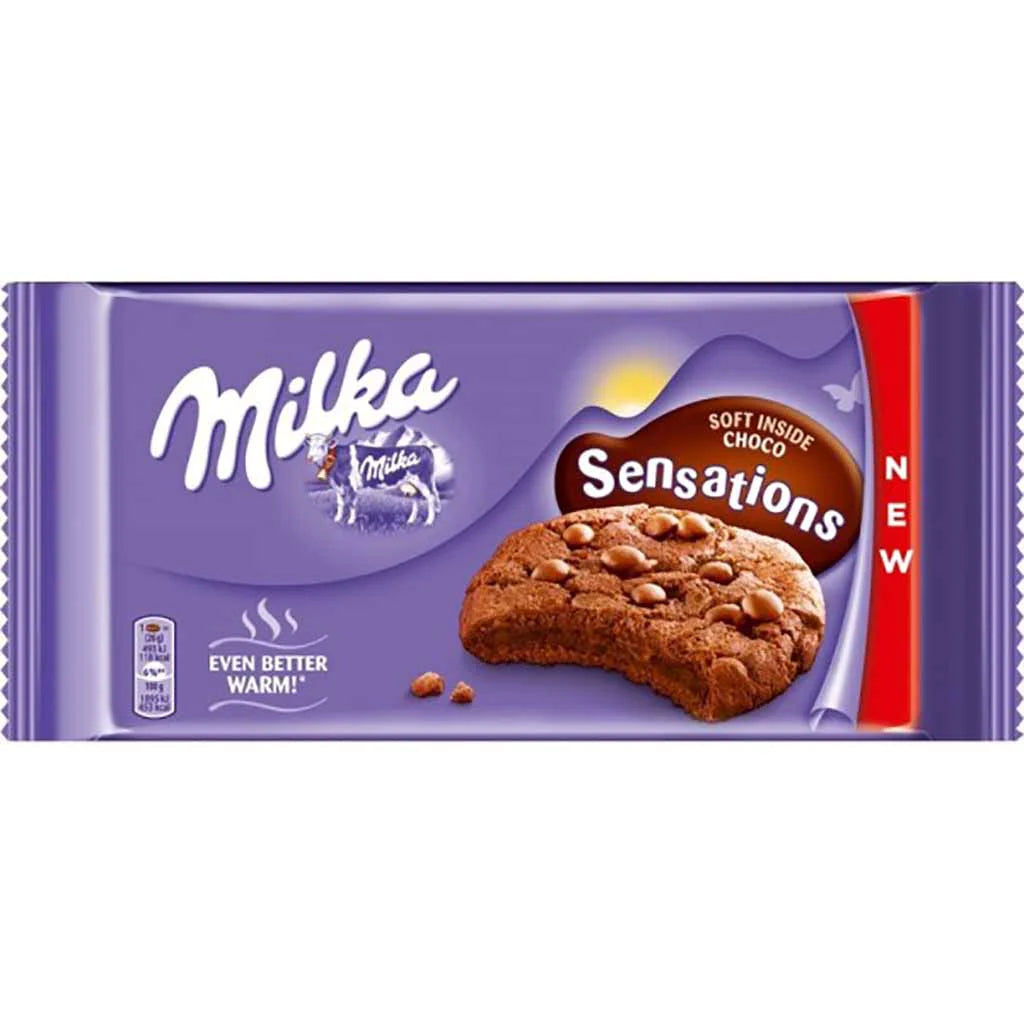 Front of Milka Chocolate Cookie Sensations pack displaying the Milka logo, cookie image, and details of soft chocolate cookies (156g pack)