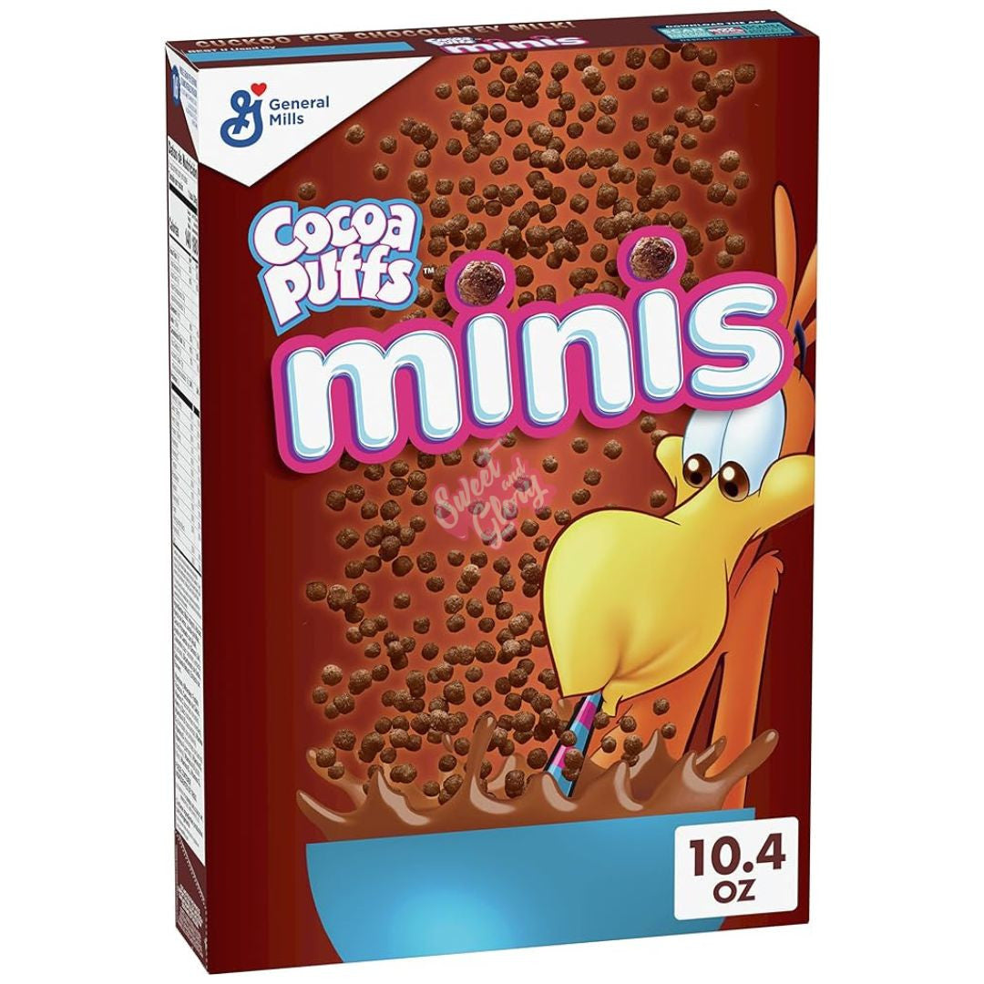 Front of Cocoa Puffs Mini's box showing the vibrant logo, cocoa-puff cereal, and playful character design (294g pack)