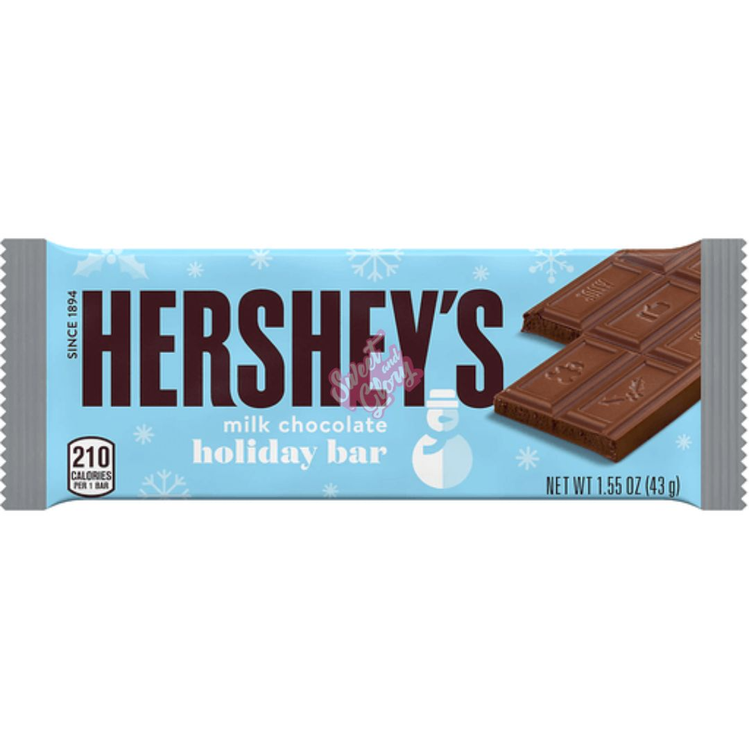 Front of Hershey's Milk Chocolate Holiday Bar package showing the logo, milk chocolate design, and festive snowflake background (43g)