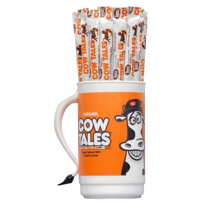 Front of Cow Tales Caramel Branded Tumbler showcasing vibrant orange design with Cow Tales branding and a cow character illustration.