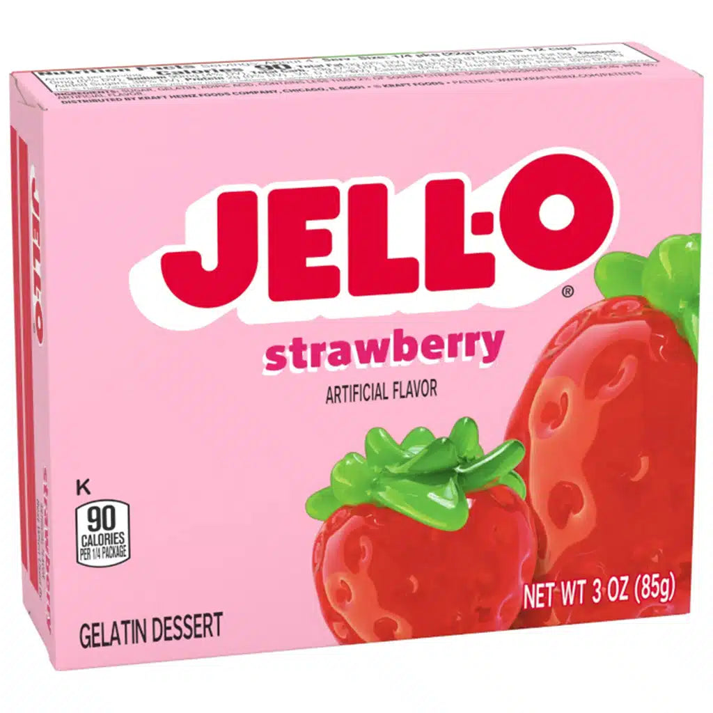 Pink box of Jell-O Strawberry flavor gelatin dessert on a white background