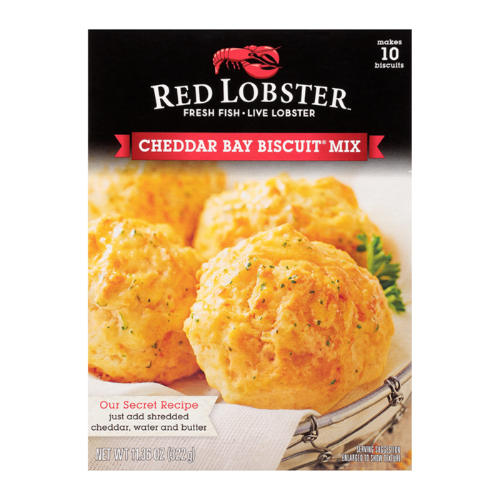 Front of Red Lobster Cheddar Biscuit Mix box featuring golden biscuits, logo, and a serving suggestion with a pack size of 322g