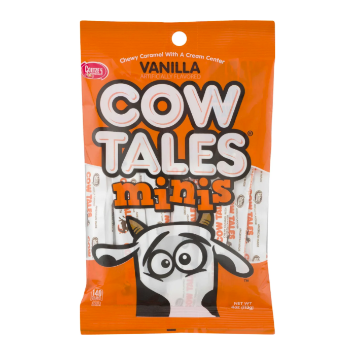 Front of Cow Tales Vanilla Minis bag showing the orange packaging with logo and a cute cartoon cow, featuring chewy caramel and cream centre details (113g pack)