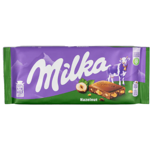 Front of Milka Hazelnut chocolate bar showing the Milka logo, hazelnut elements, and chocolate bar design (100g pack)