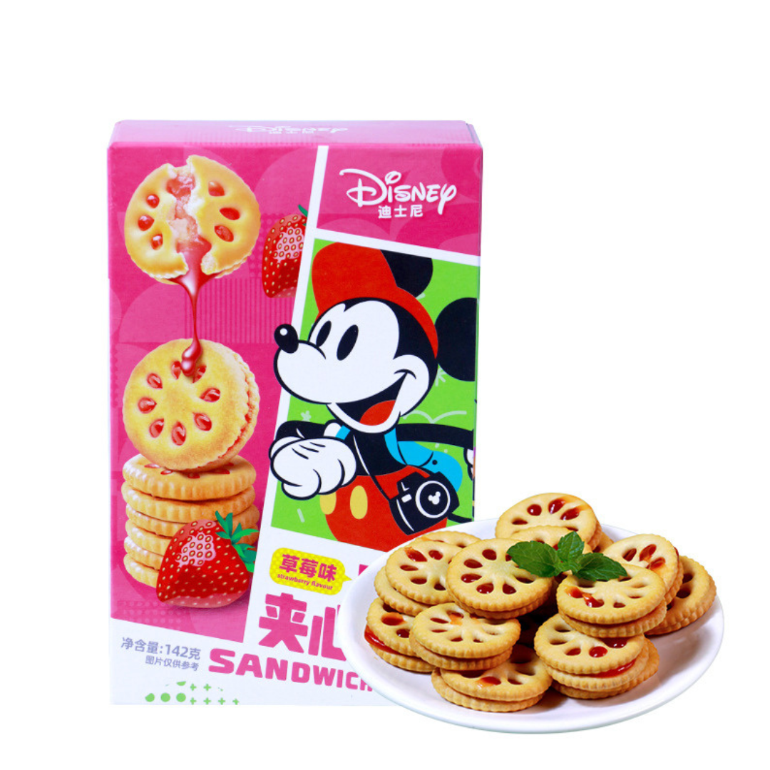Front of Disney Jam Sandwich Cookies Strawberry box featuring a playful Mickey Mouse, strawberry flavour label, and a stack of sandwich cookies. (142g pack)