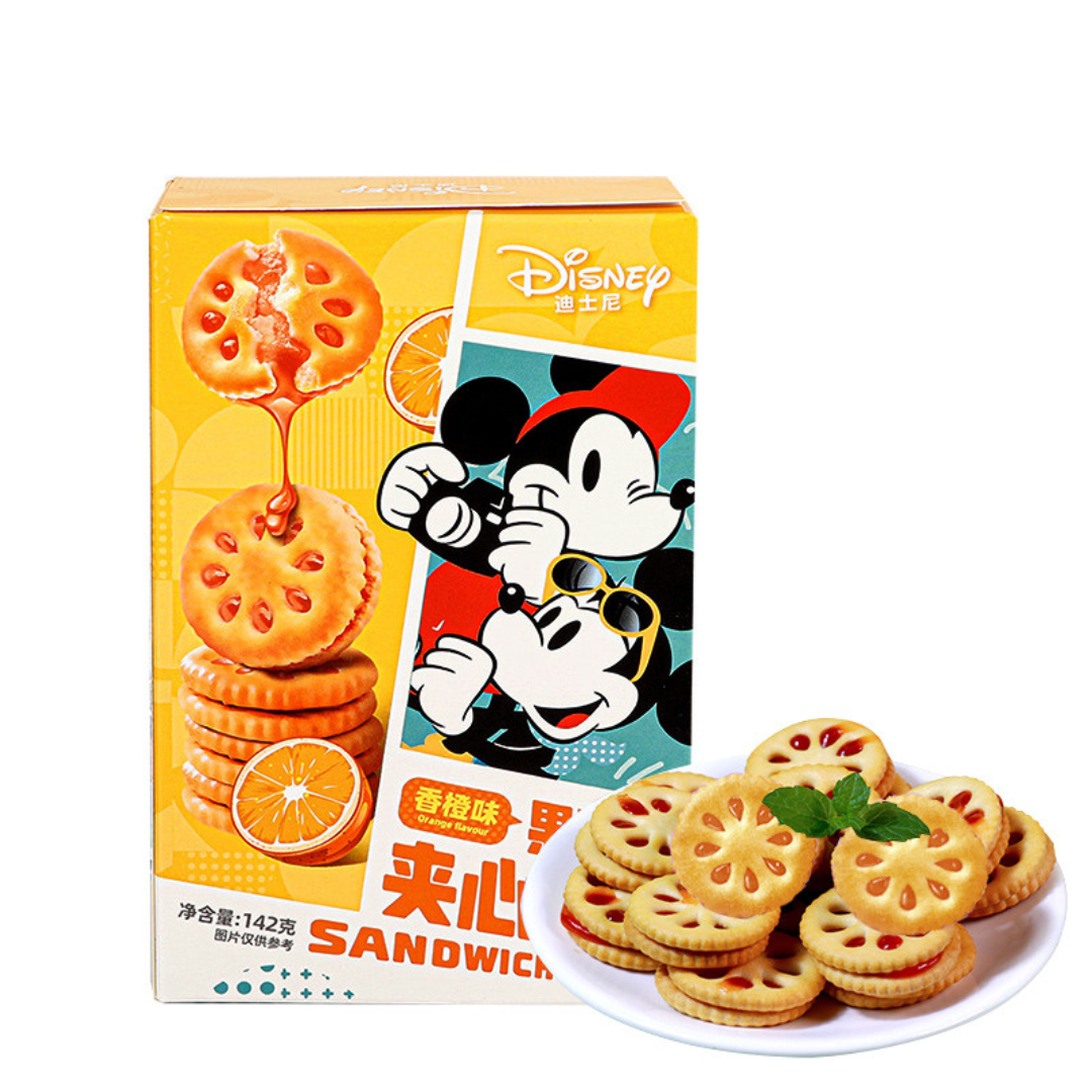 Front of Disney Jam Sandwich Cookie box showing vibrant orange and cartoon graphics with orange flavour label, featuring a 142g pack size.