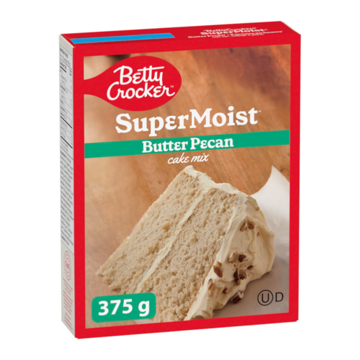 Front of Betty Crocker Super Moist Butter Pecan Cake Mix box showing logo, delicious cake slice with butter pecan flavour, and 375g pack size