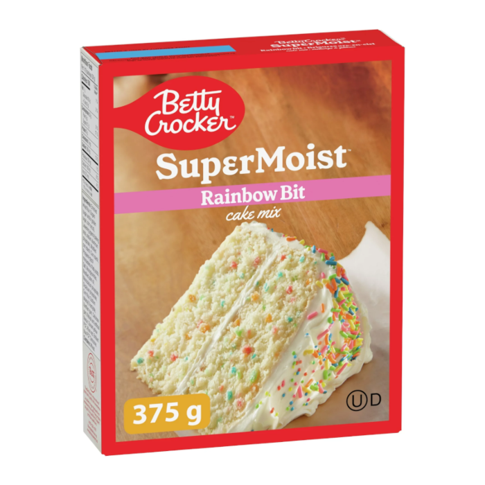 Front of Betty Crocker Rainbow Bit Cake Mix box featuring colourful sprinkles on a cake, logo, and 375g size.