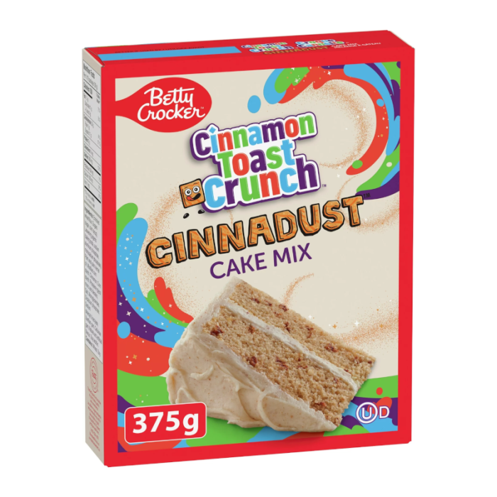 Front of Betty Crocker Cinnamon Toast Crunch Cake Mix box featuring colourful design, logo, and image of a slice of cake (375g pack)