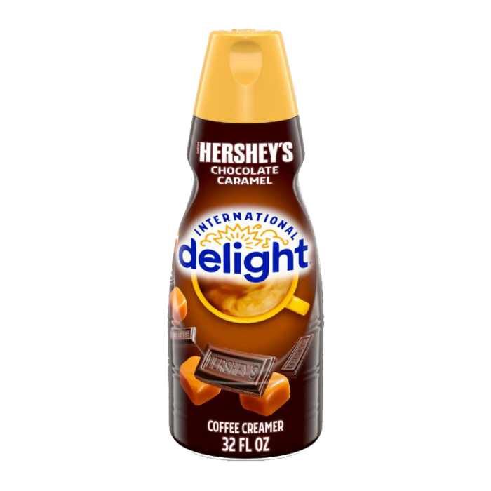 Front of International Delight Coffee Creamer Hershey's Chocolate Caramel bottle showing logo, chocolate and caramel design, and 946ml pack size