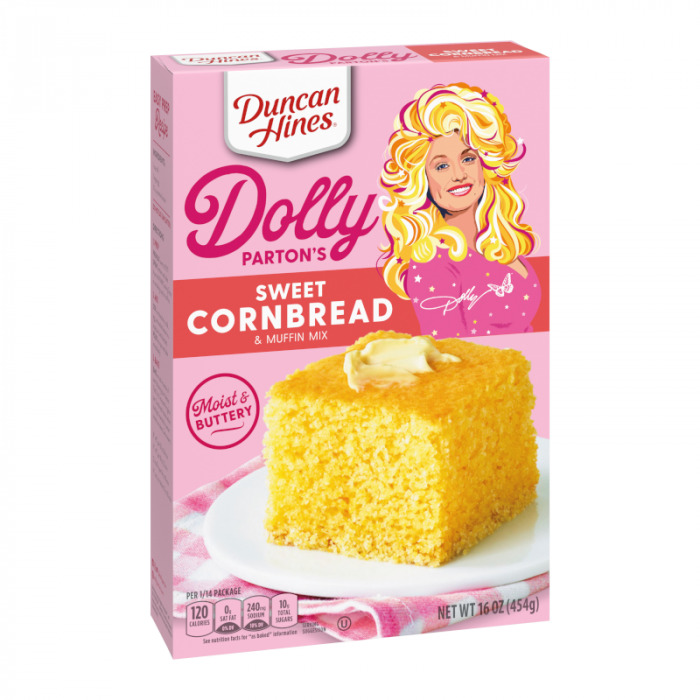 Front of Duncan Hines Dolly Parton's Sweet Cornbread Mix box (454g) featuring a buttery cornbread slice and vibrant pink packaging