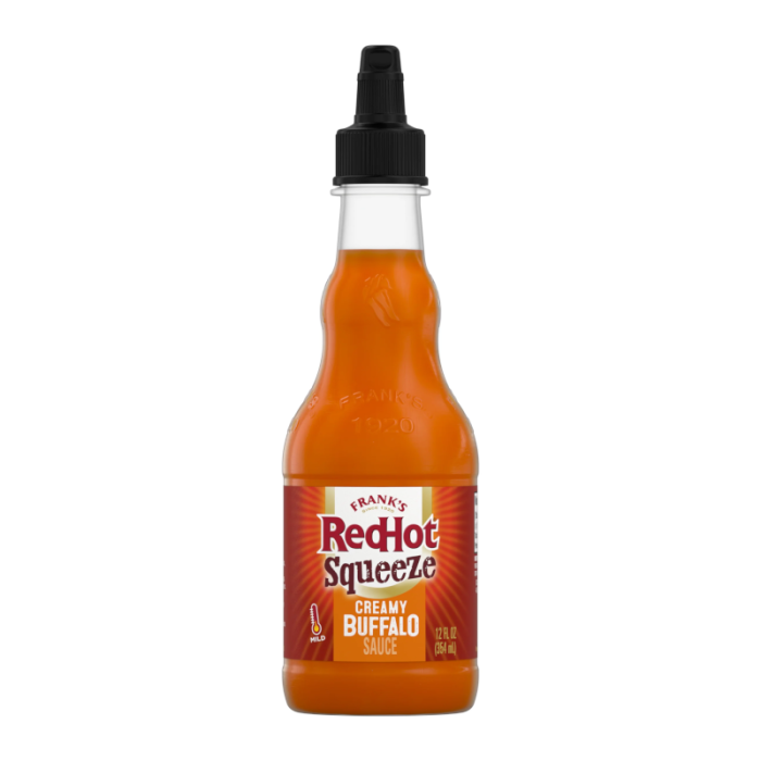 Front of Frank's Red Hot Squeeze Creamy Buffalo Sauce bottle featuring the logo, creamy buffalo graphics, and pack size (354ml)