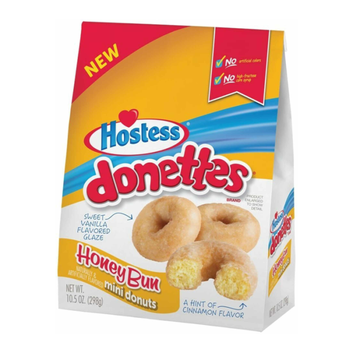 Front of Hostess Honey Bun Mini Donettes bag showing colourful logo, sweet vanilla glaze donuts, and hint of cinnamon flavour (298g pack)