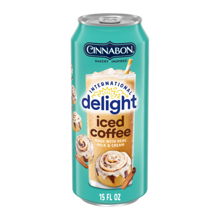 Front of Cinnabon Iced Coffee can featuring logo, iced coffee drink with a cinnamon roll, and pack size of 443ml