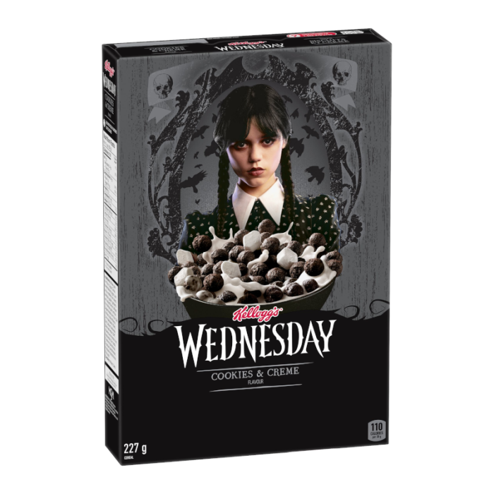 Front of Kellogg's Wednesday Cookies & Creme Cereal box featuring cookies and cream flavour with a creative design and 227g pack size