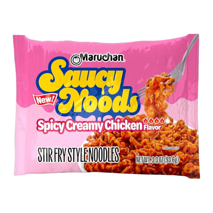Front of Maruchan Saucy Noods Spicy Creamy Chicken Ramen noodles pack showing bright pink packaging and a forkful of saucy noodles (93g)