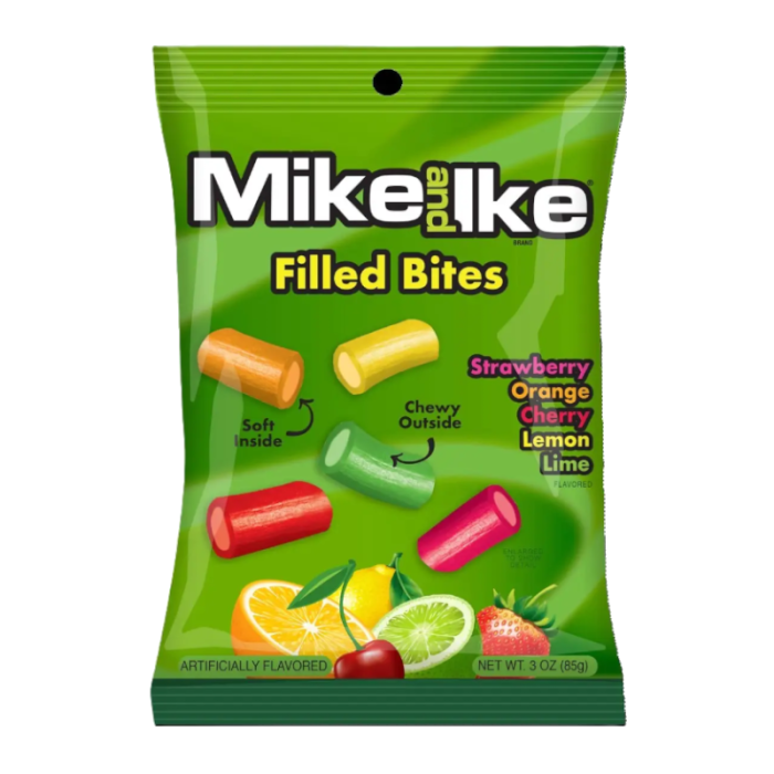 Front of Mike & Ike Filled Bites pack showing bright green bag with logo, soft centre chewy candy pieces in strawberry, orange, cherry, lemon, and lime flavours (85g pack)