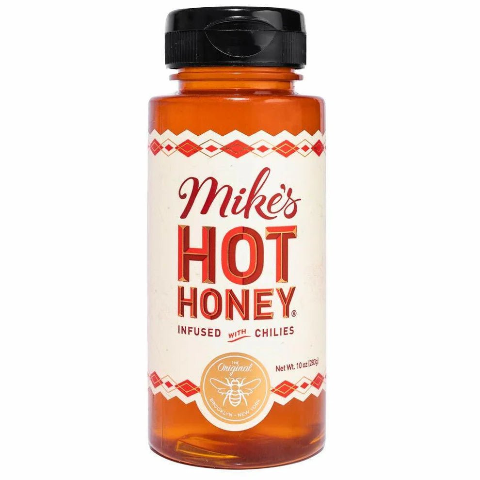 Front of Mike's Hot Honey bottle featuring bold red logo, chili infusion label, and clear packaging showing honey (340g pack)