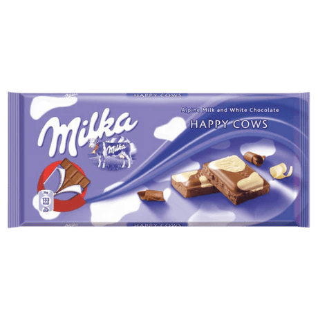 Front of Milka Happy Cow (90g) wrapper featuring the logo, smooth alpine milk and white chocolate imagery, and playful cow design.