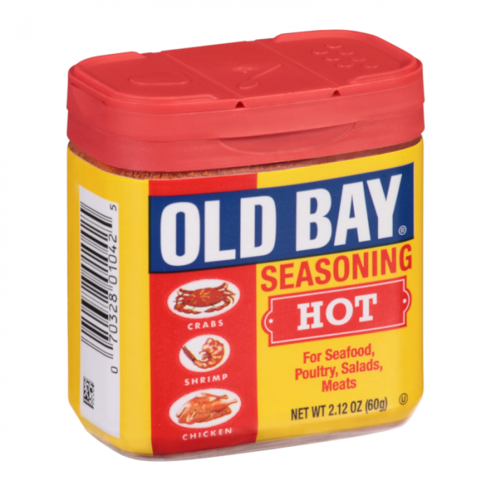 Front of Old Bay Hot Seasoning Blend container showing bright red and yellow packaging with seafood illustrations and a 60g label.