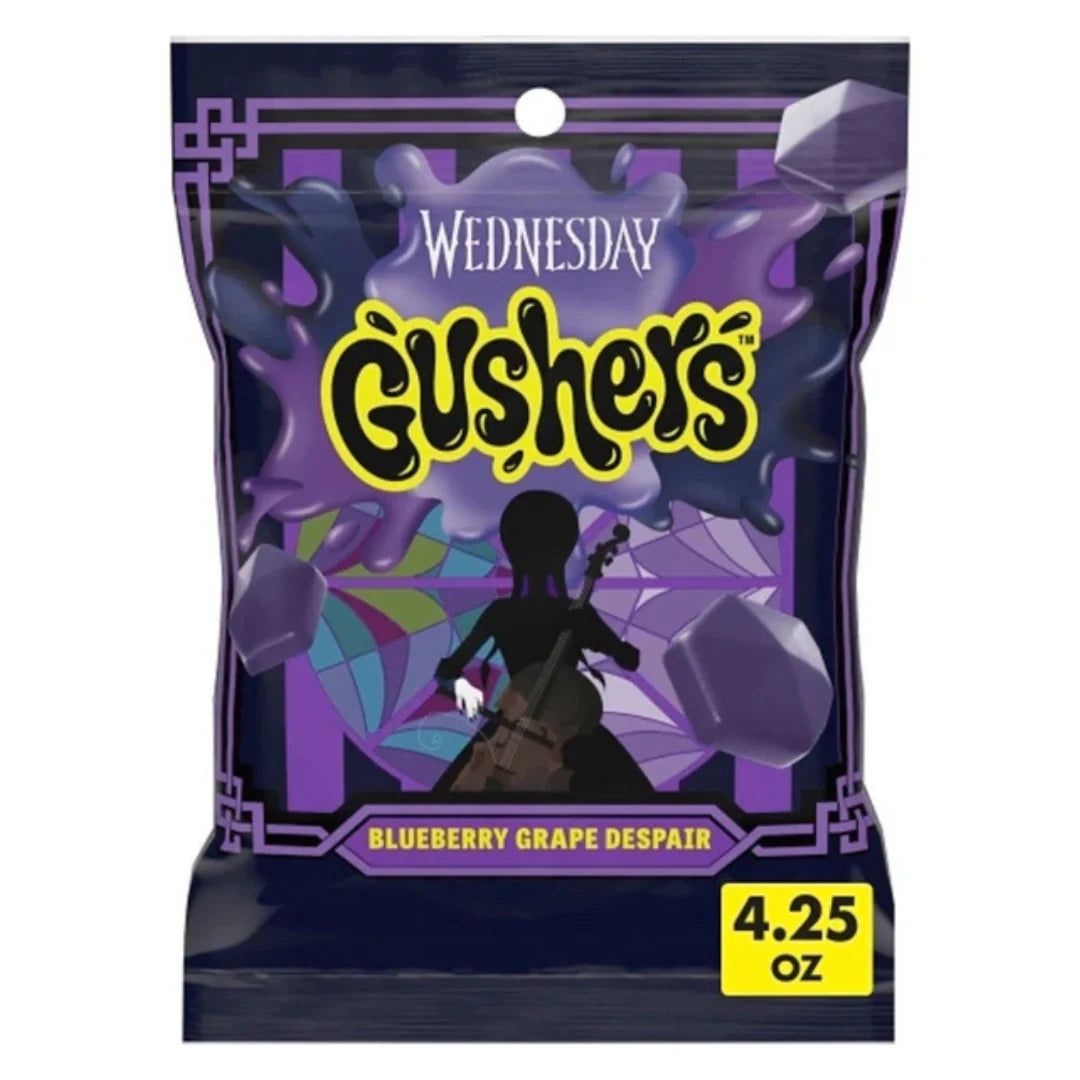 Front of Gushers Wednesday Addams Bluenerry Grape bag with colourful design, showing blueberry grape flavour and 120g size.