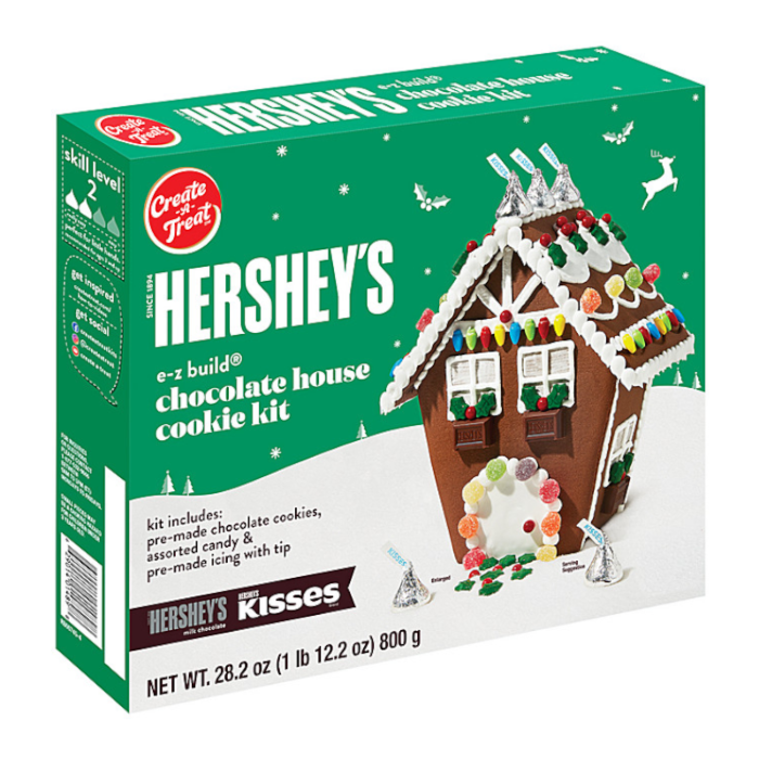 Front of Hershey's Build Your Own Chocolate House Cookie Kit showing colourful cookie house, assorted candies, and pre-made icing (794g pack)
