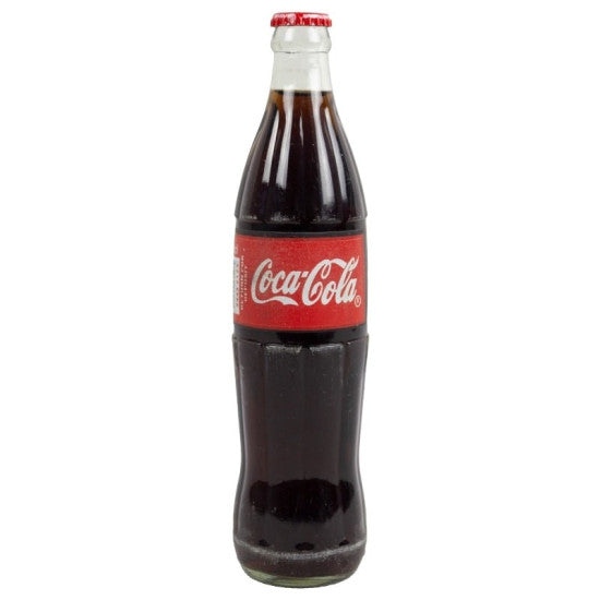 Front of Nigerian Coca-Cola Glass Bottle showing the logo on a red label with 500ml size prominently featured