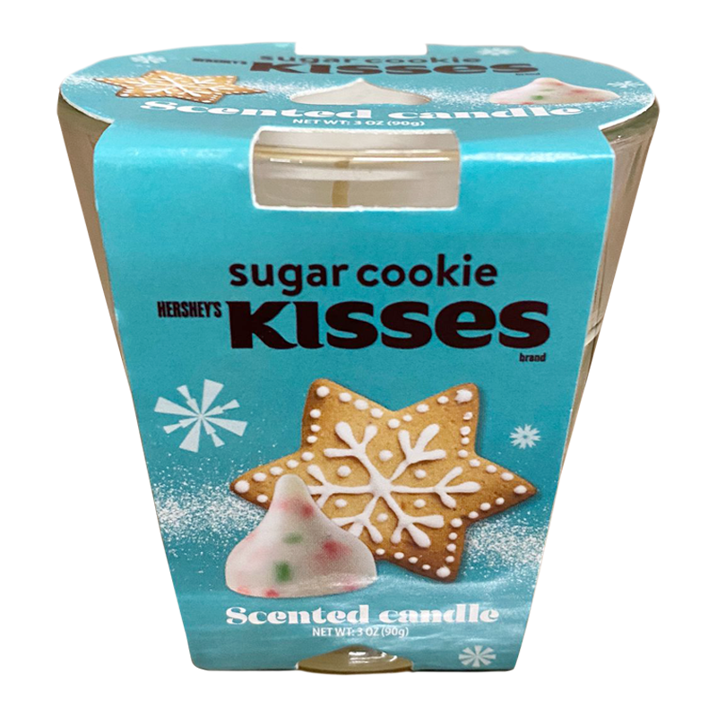 Front of Hershey's Sugar Cookie Kisses Scented Candle showing a blue label with snowflake design, featuring a decorative gingerbread cookie and Christmas-themed accents (90g)