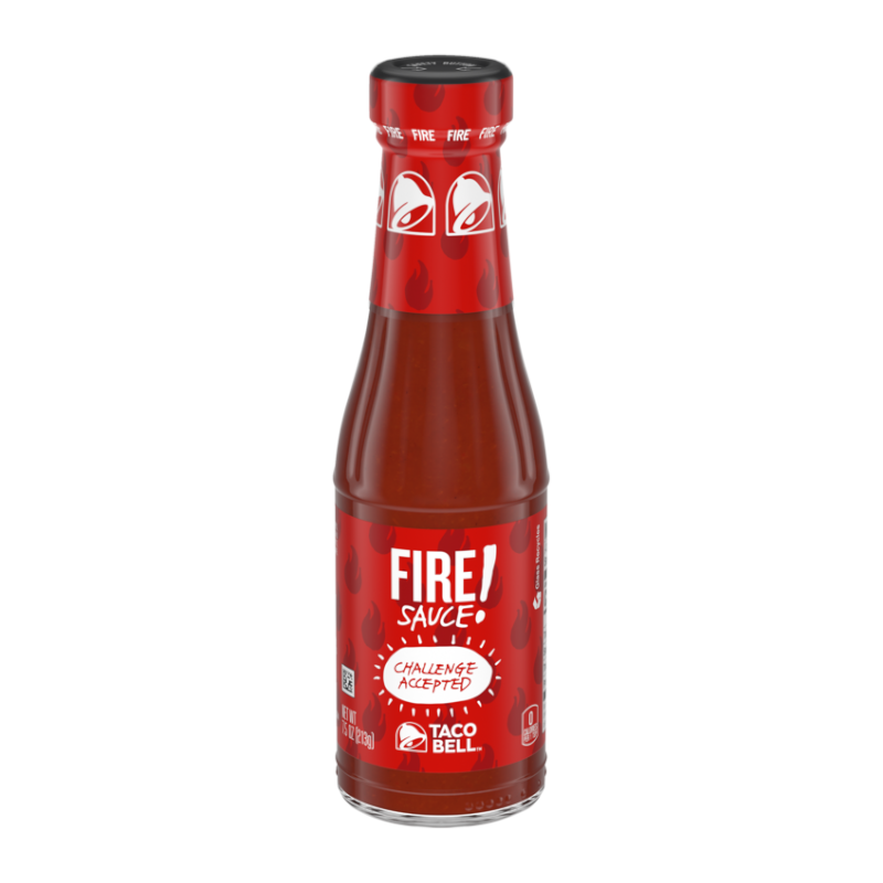 Front of Taco Bell FIRE Hot Sauce bottle showing bold red logo, fiery design elements, and 'Challenge Accepted' label (213g pack)