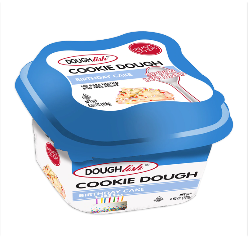 Front of Doughlish Birthday Cake Cookie Dough tub showing blue lid, logo, and birthday cake flavour label, with a spoon included (128g pack)
