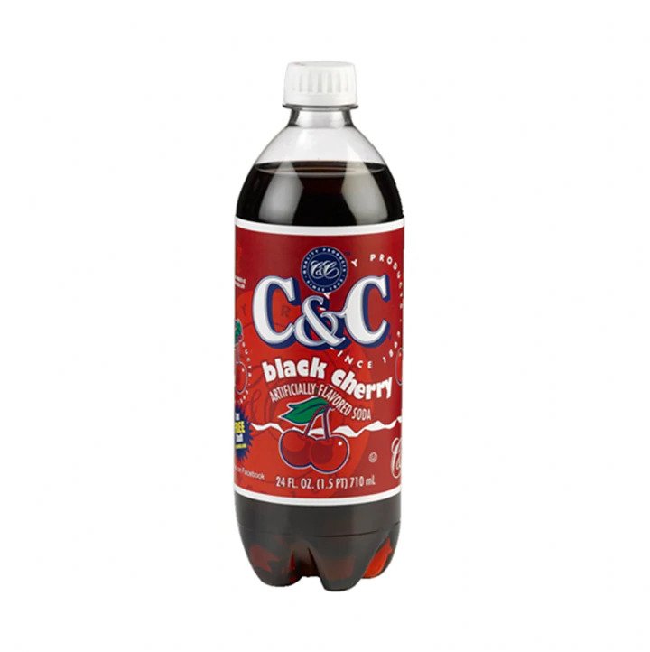 Front of C&C Black Cherry Soda bottle showing bold logo, black cherry flavour label, and 710ml size indication.