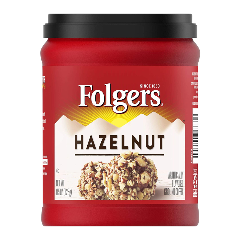 Front of Folgers Hazelnut Coffee jar showing red packaging, hazelnut flavour label, and image of coffee with hazelnuts (326g pack)
