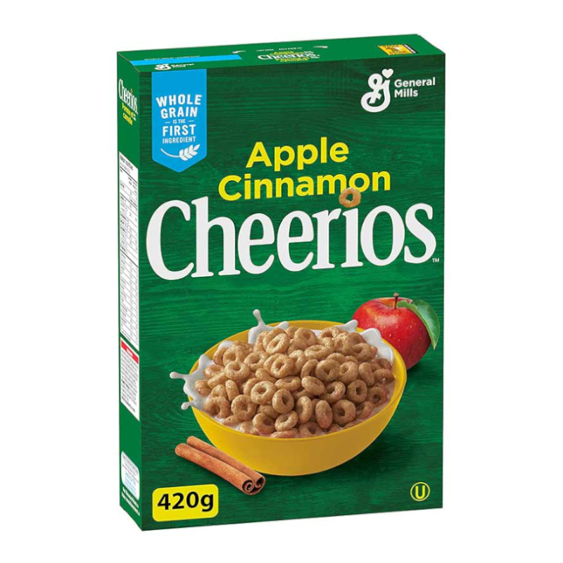 Front of General Mills Apple Cinnamon Cheerios box featuring a green background, logo, apple and cinnamon illustrations, and a yellow bowl filled with cereal (420g pack)