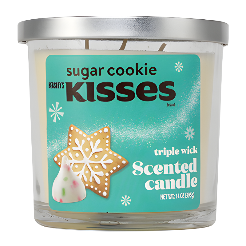 Front of Hershey's Sugar Cookie Kisses Scented Candle showing turquoise label, snowflake design, and a festive sugar cookie image (396g)
