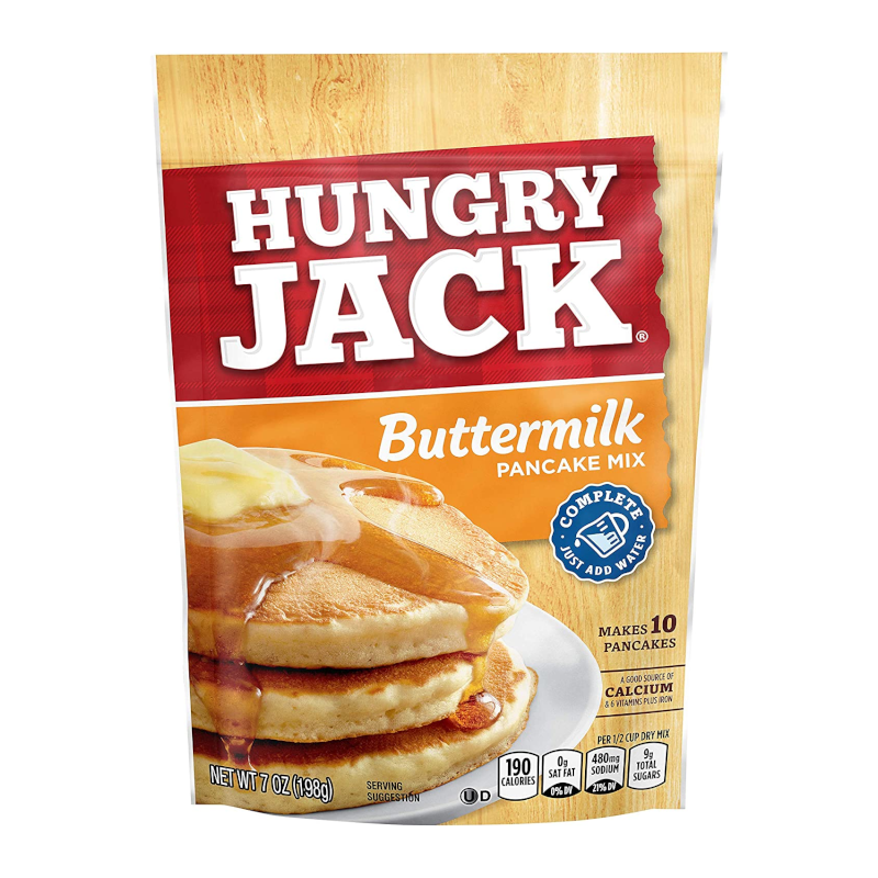 Front of Hungry Jack Buttermilk Pancake Mix showing red logo, buttermilk label, stack of pancakes with syrup, and 198g size