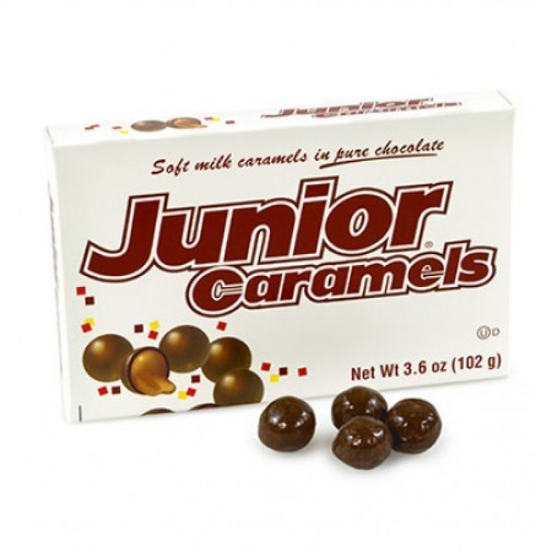 Front of Junior Caramels Theatre Box showing bold red logo, soft milk caramels in pure chocolate, and 102g pack size.