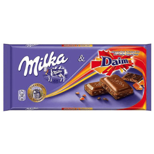 Front of Milka Daim chocolate bar packaging showing the Milka logo and Daim pieces, 100g pack size with vibrant purple colour.